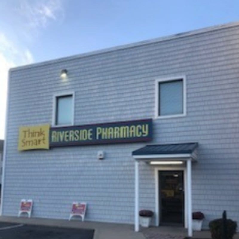 Riverside Pharmacy storefront on Riverside Drive, with its sign above the entrance